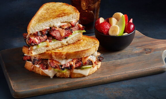 Pastrami melt with fruit bowl and soft drink